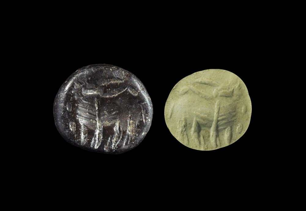 Near Eastern Sassanian Stone Stamp Seal with Ox: Sassanian Empire, 224-651 AD. A plano-convex stamp seal with intaglio ox motif; supplied with impression. 3.83 grams, 12 mm (1/2"). From an important Mayfair, London, collection; acquired in the 1990s