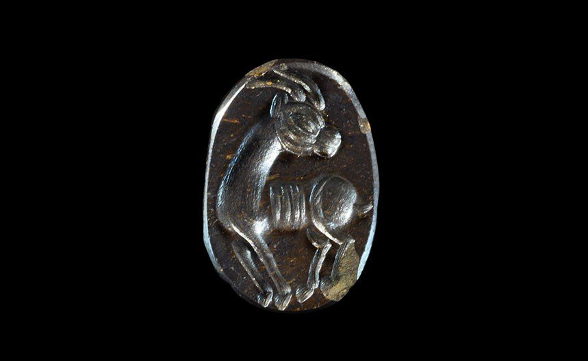 Near Eastern Sassanian Stone Stamp Seal with Ibex: Sassanian Empire, 224-651 AD. A carved black pierced stone with intaglio design to the flat face of a regardant ibex. 4.50 grams, 17 mm (3/4"). From a London collection; acquired in the 1990s. [No Res