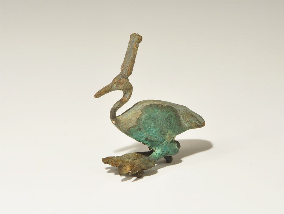 Egyptian Style Bronze Ibis Statuette: An undated archaistic cast model ibis with attachment pegs to the underside of the feet. 78 grams, 70 mm (2 3/4"). Property of a London collector, acquired early 1990s.