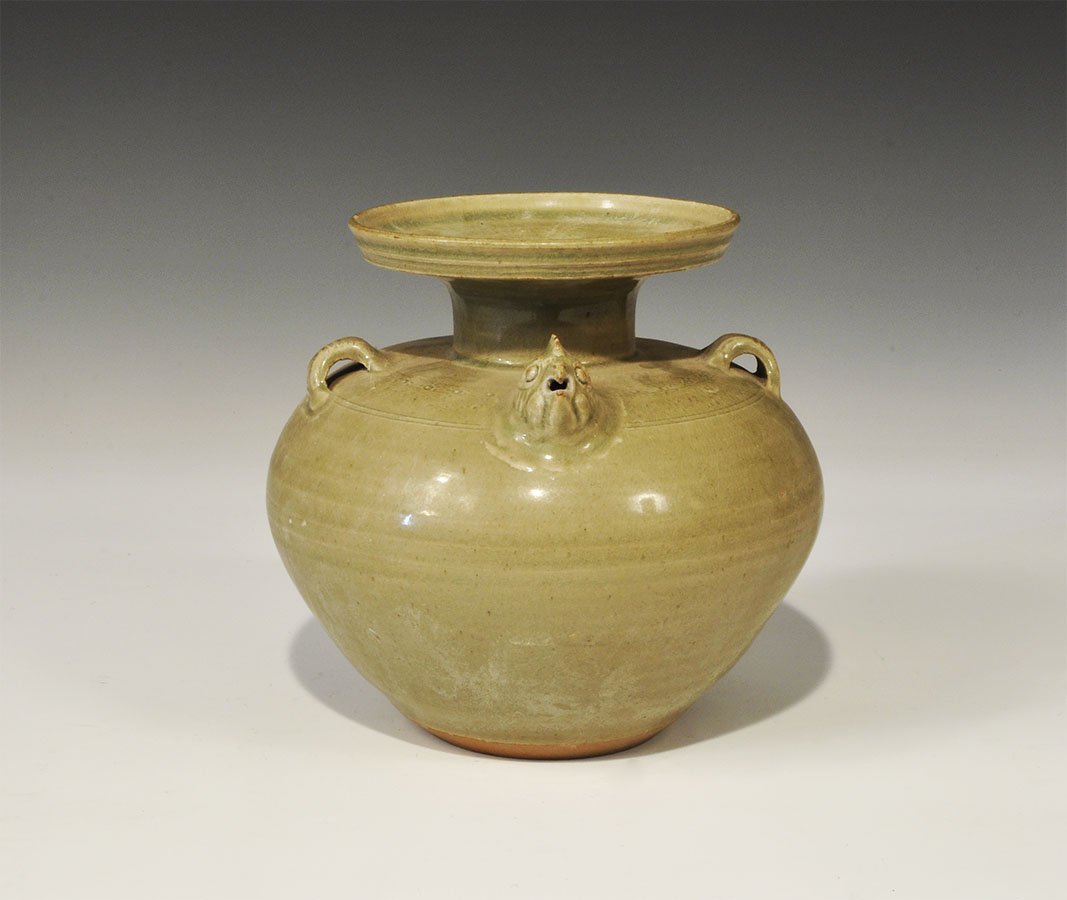 Cambodian Style Ceramic Vase with Bird-Head Spout: An undated archaistic celadon ware vase with broad shoulder and flanged rim, two loops to the shoulder, stub tail and bird-head spout. 1.1 kg, 16 cm (6 1/4"). Property of a London collector, acquired 