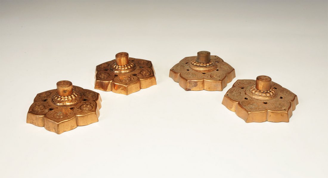 Chinese Tibetan Copper Door Fitting Set: A set of four undated archaistic copper door fittings, each comprising asexfoil raised plaque with scrolled vegetation motifs, ribbed central pedestal and hollow knop handle above. 420 grams total, 12