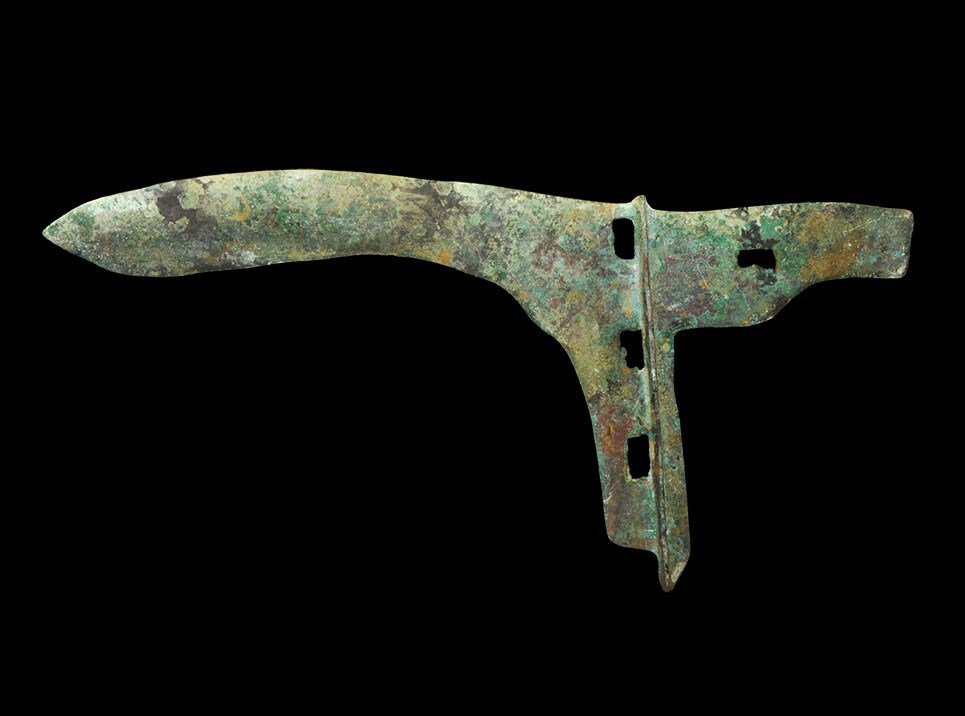 Chinese Style Bronze Halberd: An undated archaistic cast halberd head with leaf-shaped blade, transverse rib with atttachment holes, rectangular extension to the rear. 192 grams, 25 cm (9 3/4"). Property of a German professional.