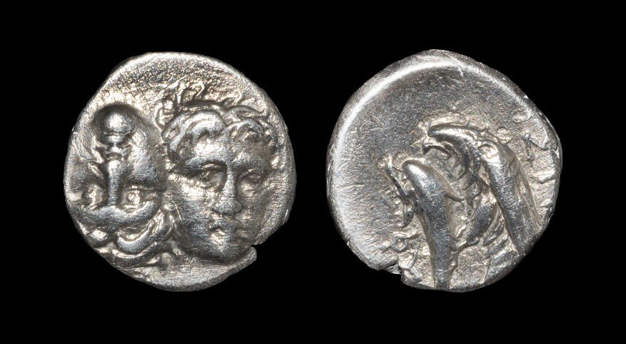 Greek Istros - Thrace - Opposed Heads Drachm: Circa 400-350 BC. Obv: two facing male heads, one inverted. Rev: ISTRH legend above eagle standing left on dolphin, FY below. AMNG 425; Mionnet Supp. II, 85; cf. Sear 1669; see Wildwinds.com (this coi