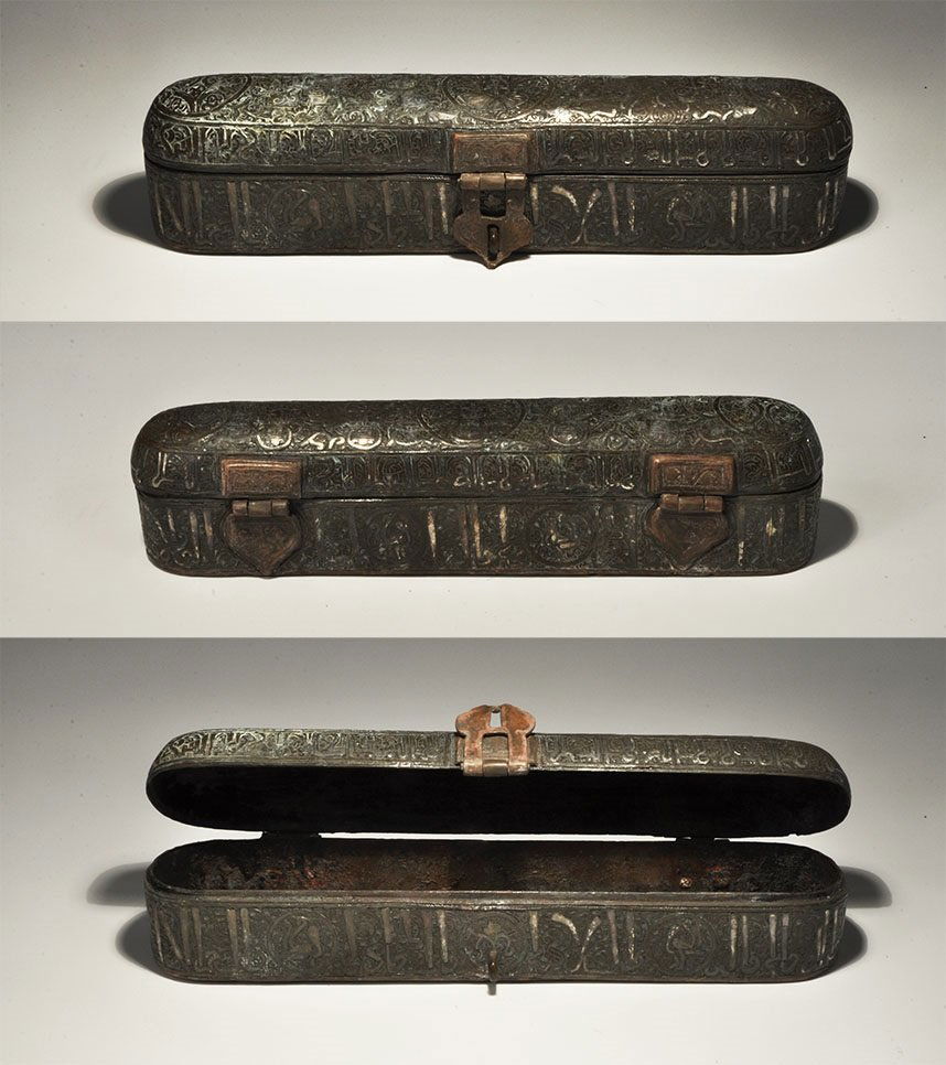 Islamic Style Bronze Pen Box with Calligraphic Silver: An undated archaistic hinged pen box, elliptical in plan with domed lid; a band of silver-inlaid calligraphic text to the side with rosettes containing birds; three rosettes to the underside each with