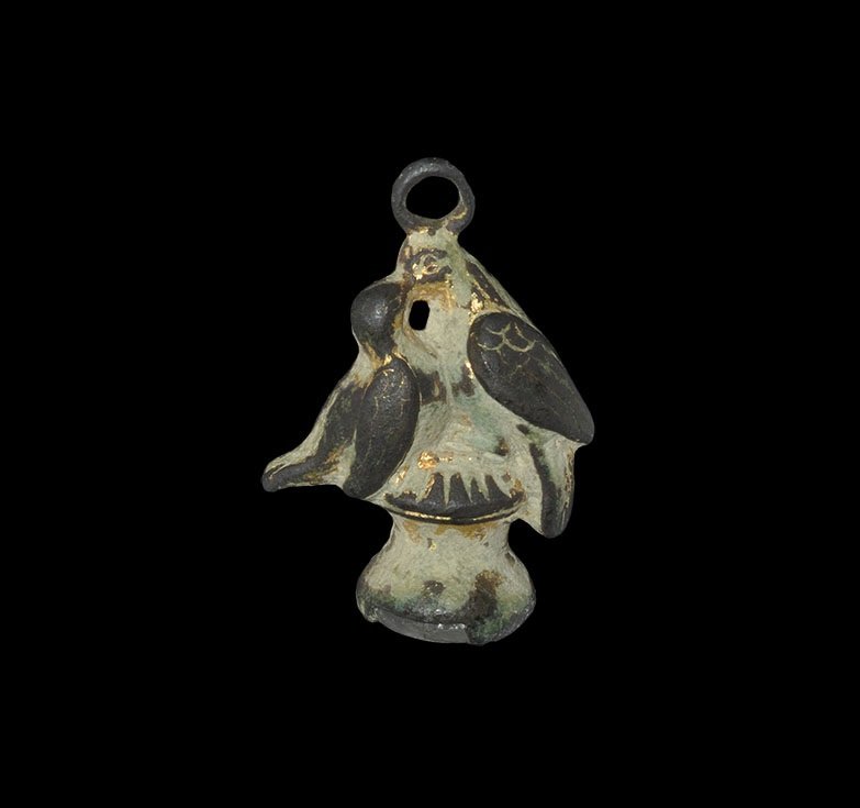 Post medieval Gilt-Bronze Pendant Intaglio Seal: 19th century AD. A cast gilt-bronze pendant of two birds on a cotton-reel perch, suspension loop above; glass intaglio of a running hare inset to the underside. 9.11 grams, 28 mm (1"). Property of a M