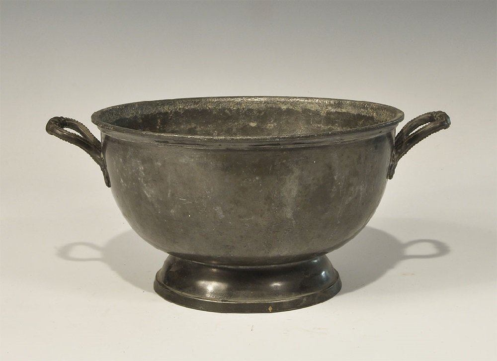 Post Medieval Pewter Rose Bowl: 20th century AD. A hemispherical bowl with textured rim, pedestal base, two strap handles with collars; stamped to the underside 'P', 'JAMES BIRCH & SONS', 'SHEFFIELD' and banner over number 668. 1.3