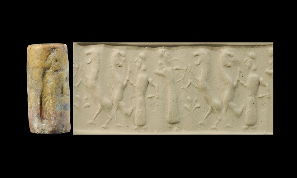 Near Eastern Akkadian Cylinder Seal: 2400-2200 BC. A carved stone cylinder seal depicting a standing figure grasping the foreleg of a quadruped and a second quadruped attacking a robed figure with a drawn arrow and bow. Private collectio