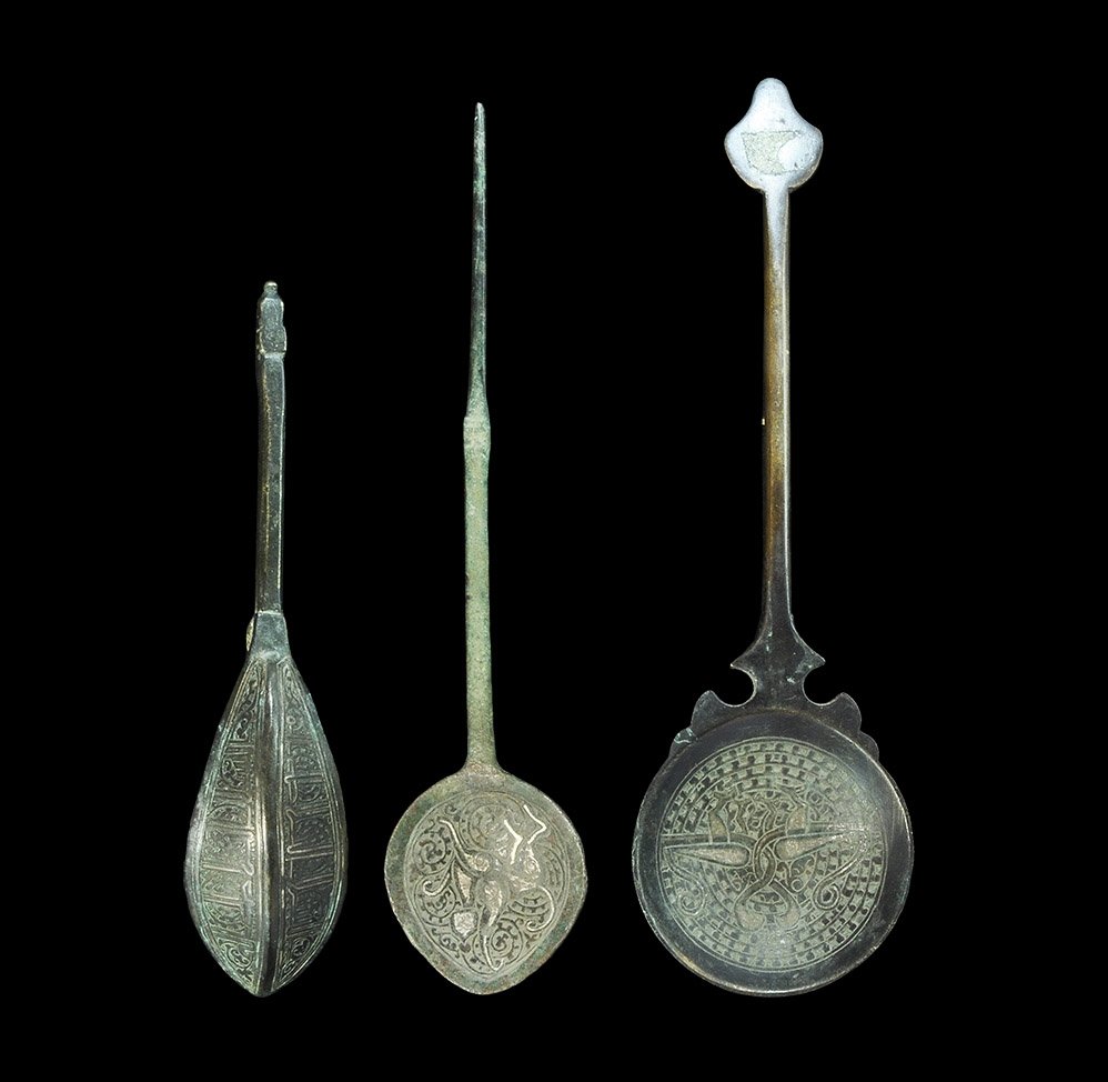 Islamic Bronze Spoon Group: 18th-19th century AD. A mixed group of bronze spoons comprising: one with shallow bowl inlaid silver bird on a hatched field to the underside, pair of opposed birds to the inner face; one with ellipti