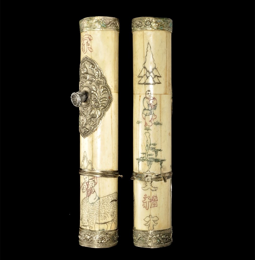 Far Eastern Vietnamese Bone and Silver Mounted Opium: 18th-19th century AD. A decorated opium pipe constructed from bone plates and silver fittings; the pipe with lightly incised line drawings inked in red, black and green depicting human and animal figu