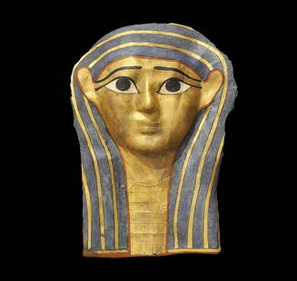 Egyptian Gilt Cartonnage Mummy Mask: Late Period, 664-332 BC. A cartonnage mummy mask covered with gesso and decorated with gilding; the facial details picked out in black paint with white in the eyes and red outline to the Nemes crown s