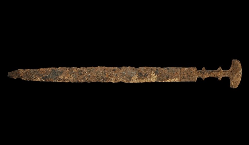 Near Eastern Achaemenid Iron Akenakes Dagger: 559-330 BC. A long willow-leaf lentoid-section Iron Age blade and integral grip and pommel with lateral flanges to each face to accept an organic hilt plate. Cf. Khorasani, M.M. Arms and Armour from I