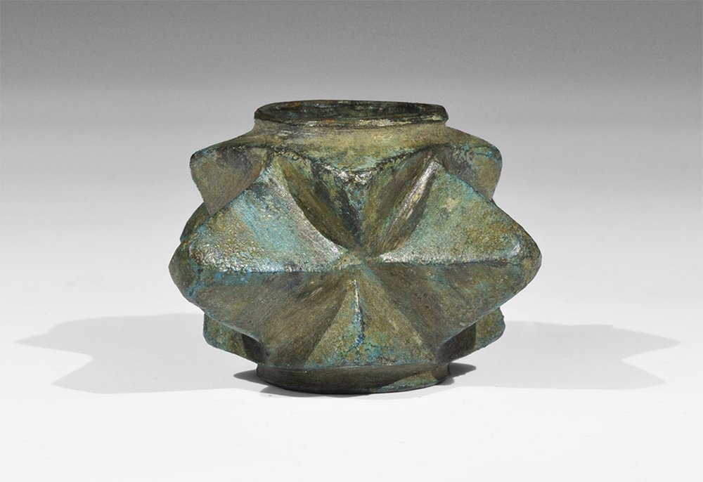 Medieval Bronze 'Morning Star' Macehead: 14th-15th century AD. A cast macehead with four pyramidal projections and a waisted square core with circular shaft hole. Ex Morris collection, Buckinghamshire, UK; acquired in the 1990s. 176 grams, 6