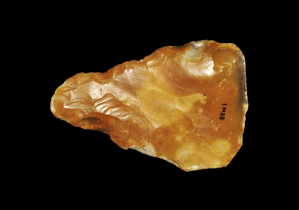 Stone Age British Handaxe: Palaeolithic, circa 400000 BP. A finely-knapped triangular flint handaxe with remnant of the cortex to the base; inked accession code EENI to one face. Ex Hampshire collection; found Kessingland, Suff