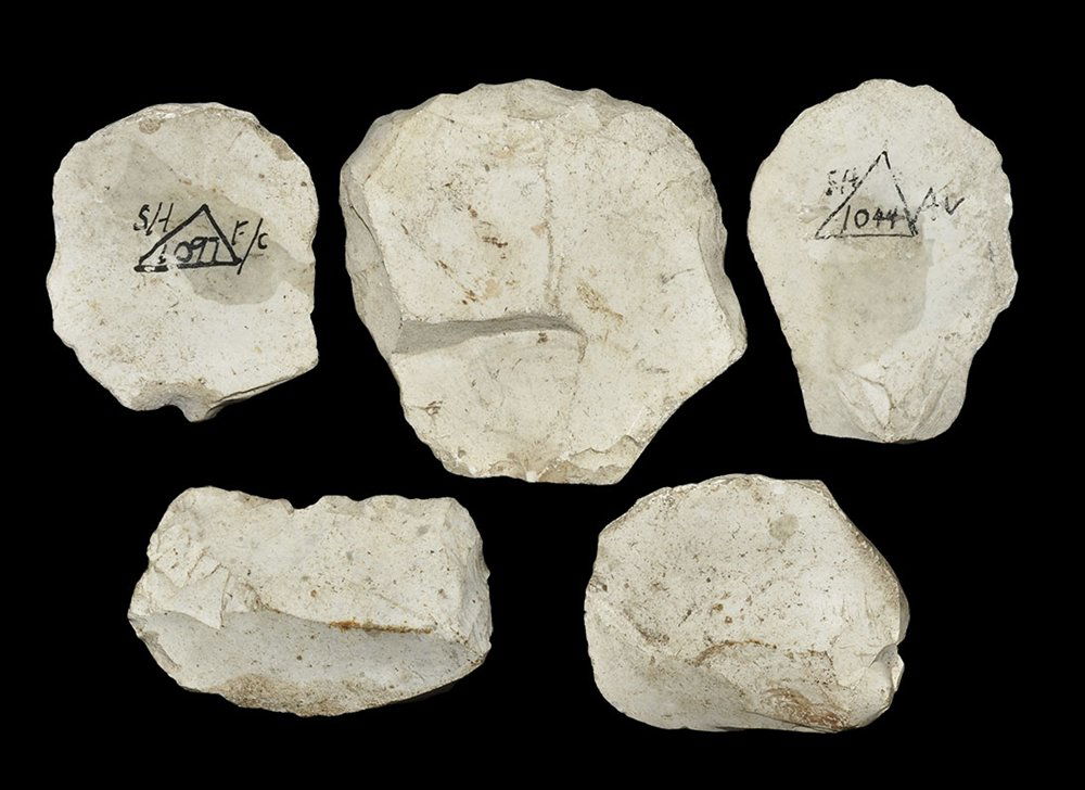 Stone Age British 'Avebury' Implement Group: Neolithic, 3000-1500 BC. A mixed flint group comprising: five convex scrapers formed on flakes with carefully knapped working edges; two with inked excavation reference number; all with typical white