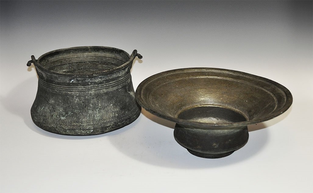 Eastern European Copper Vessel Group: 19th century AD. A group of two vessels comprising: a bowl with carinated body and broad flange rim; a bucket with broad flared base, drop handle attached to the rim. Property of a European gentleman