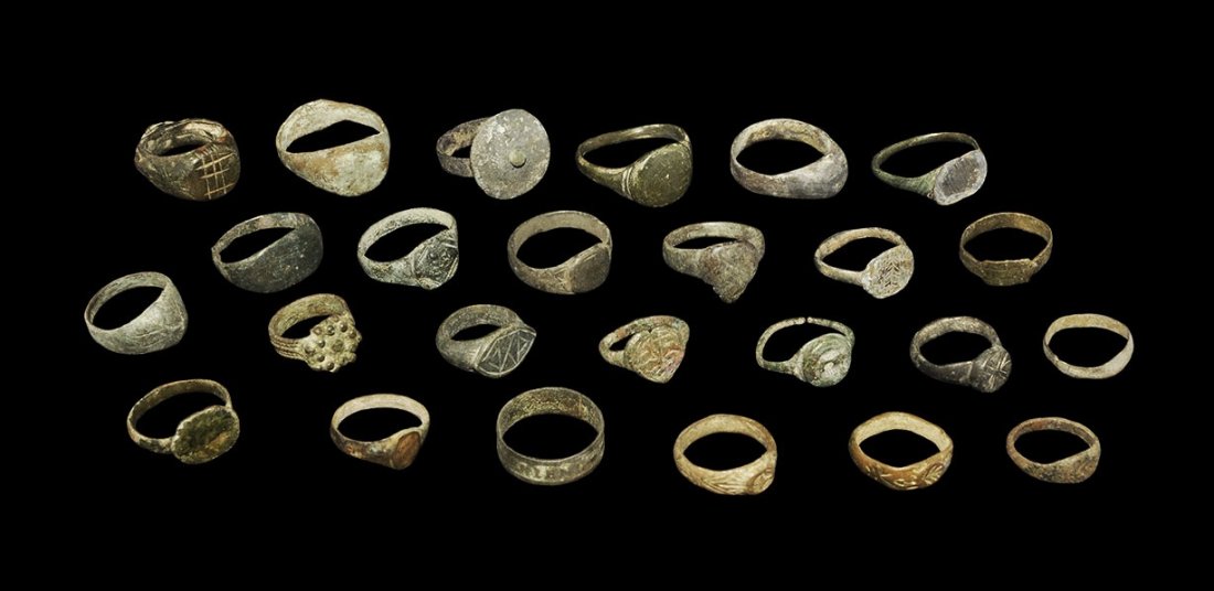 Byzantine to Medieval Bronze Finger Ring Group: 8th-16th century AD. A mixed group of finger rings comprising: two with piriform bezel; one with discoid bezel, applied pellets; two with leaf-shaped panel; two plain hoops; one with scaphoid bezel; o