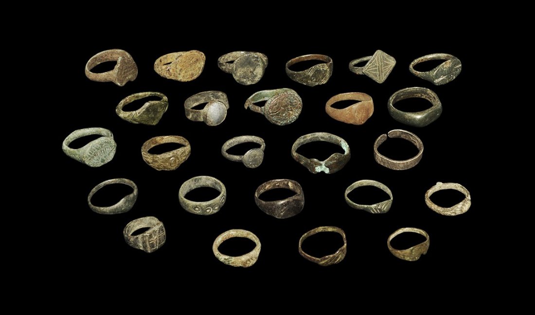 Byzantine to Medieval Bronze Finger Ring Group: 8th-16th century AD. A mixed group of finger rings comprising: three with lozengiform bezel; one with glass cabochon; one with foliage wreath bezel; four with rectangular bezel; one with ring-and-dot