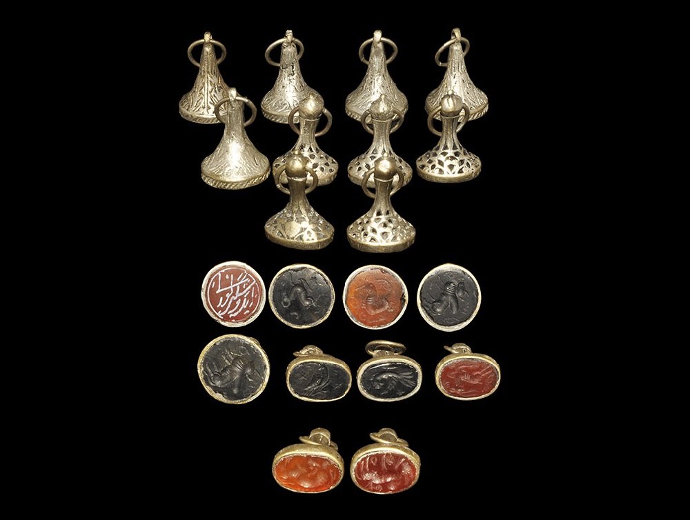 Vintage Silver Fob Seal Group: A mixed group of undated archaistic silver fob seals with discoid and elliptical heads comprising: three with intaglio ox motif; three with an ibis; one with a profile bust; two with a bird; one with