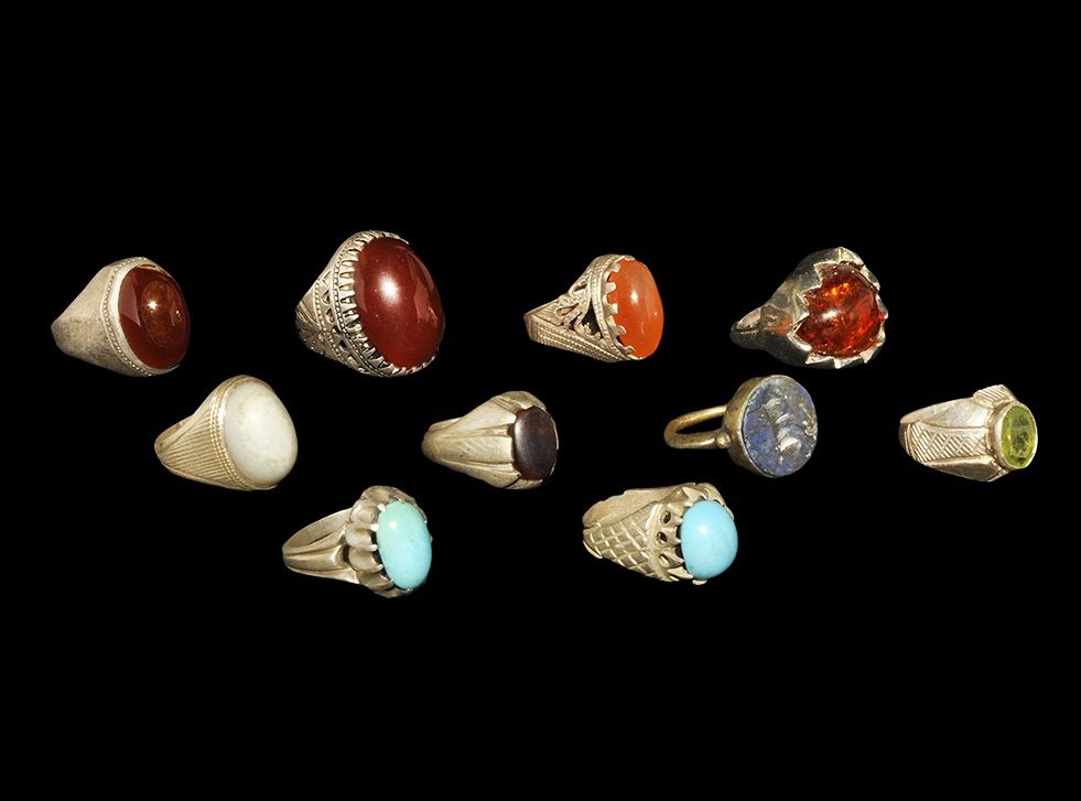 Vintage Silver Finger Ring Group: 20th century AD. A mixed group of finger rings comprising: one with dentilled bezel; seven with cabochon insert; one with facetted insert; one with lapis lazuli intaglio insert, ox motif; Central Asia