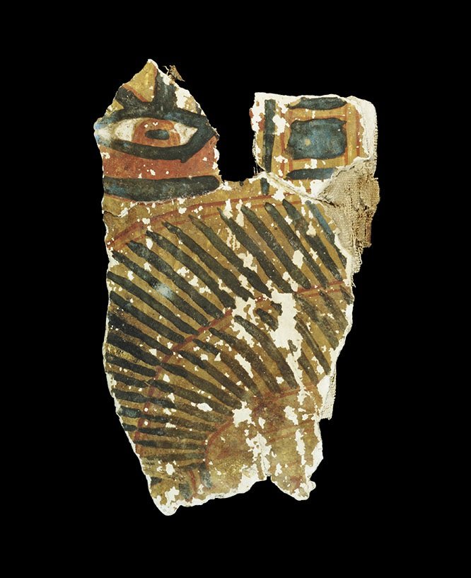 Egyptian Painted Cartonnage Fragment: 21st Dynasty, 1077-943 BC. A fragment of cartonnage from a coffin with black and red painted design on an ochre background comprising part of a feathered wing, wedjat eye and geometric border. 60 gram