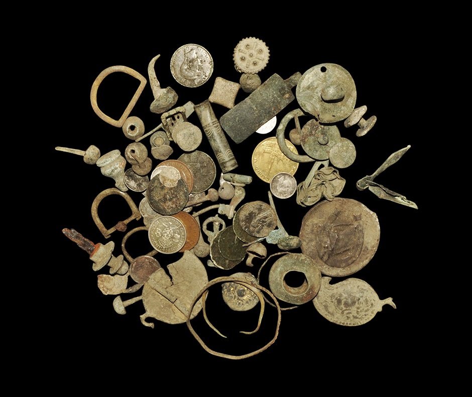 Roman to Post Medieval Mixed Artefact Group: 1st-20th century AD. A mixed group of items including: three pendants; a Roman furniture stud; a Roman horse harness pendant; a square lead weight; 20th century milled coins; three silver coins and fi