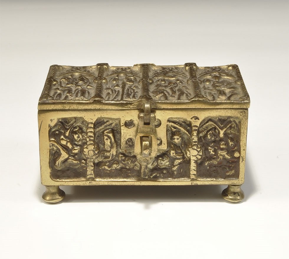 Medieval Style Brass Casket: An undated archaistic rectangular casket with hinged lid, hasp and four domed feet; to the lid and sides, arcading with figural scenes. 1.6 kg, 13.5 cm (5 1/4"). Private collection, UK; formed in the 
