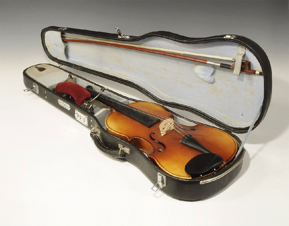 Vintage Violin and Case: 20th century AD. A 3/4 size violin with accessories in a travelling case; the violin with black fingerboard, chin-rest and tuning keys, openwork bridge, wood and horsehair(?) bow, brass rest with velv