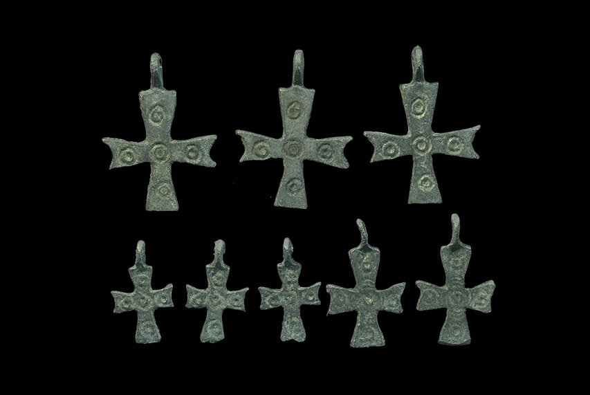 Byzantine Style Bronze Cross Pendant Group: A mixed group of undated archaistic cast cruciform pendants in three sizes, ring-and-dot motifs to one face of each. 24 grams total, 24-36 mm (1 - 1 1/2"). UK art market, acquired prior to 1980. TimeL