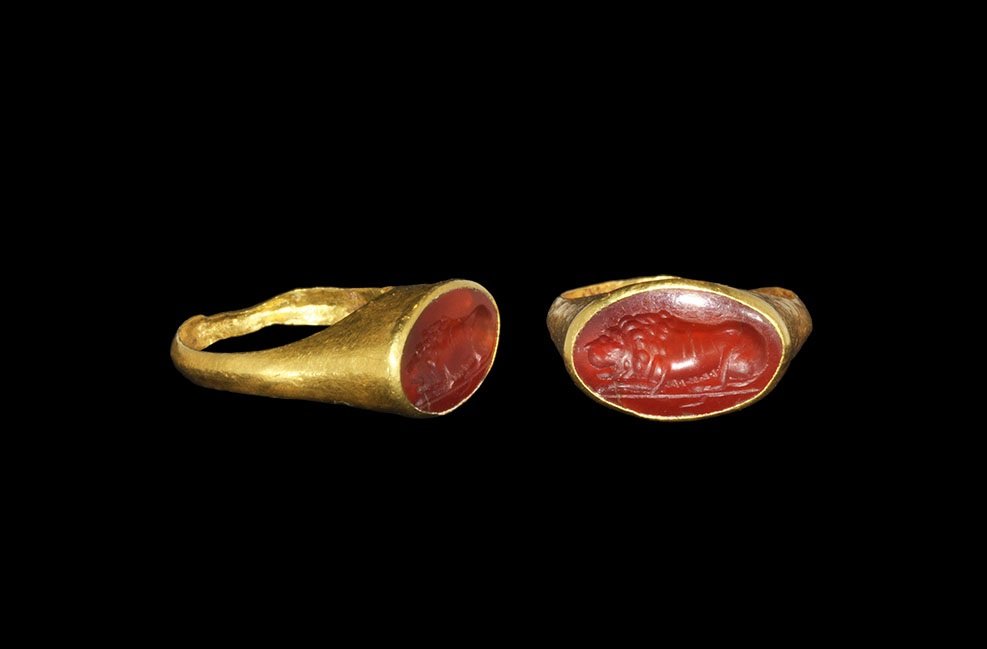 Roman Gold Ring with Carnelian Lion Intaglio: 2nd-3rd century AD A D-section hoop with tall bezel and inset carnelian intaglio of a lion resting on a baseline. Cf. Taylor, G. & Scarisbrick, D. Finger Rings from Ancient Egypt to the Present Day, O