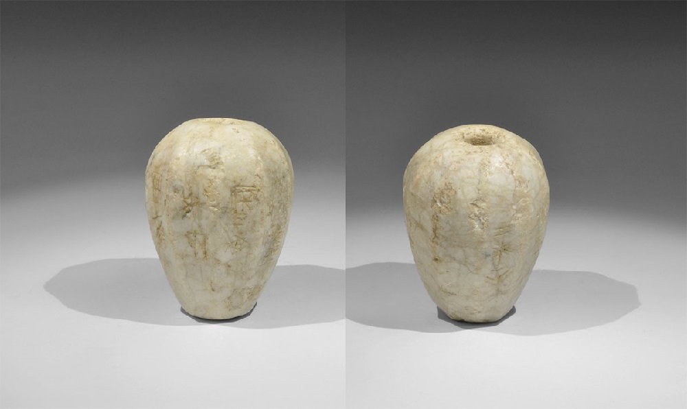 Near Eastern Sumerian Stone Macehead with Inscription: 2500 BC A pear-shaped fluted marble macehead, inscribed with seven columns of text in Sumerian pictographs: 'To Tam(muz), Mr Ezi, scribe, son of E[...], gave (this mace)'. Accompanied by an old typesc