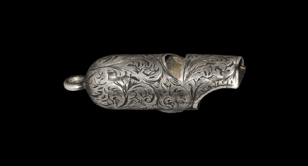 Post Medieval Stuart Period Silver Hawking Whistle: 17th-18th century AD A round-section whistle with domed end and attachment loop, scooped mouthpiece, incised scrolled foliage motifs to the body. 4.88 grams, 40 mm (1 1/2"). From an old Nottinghamshir