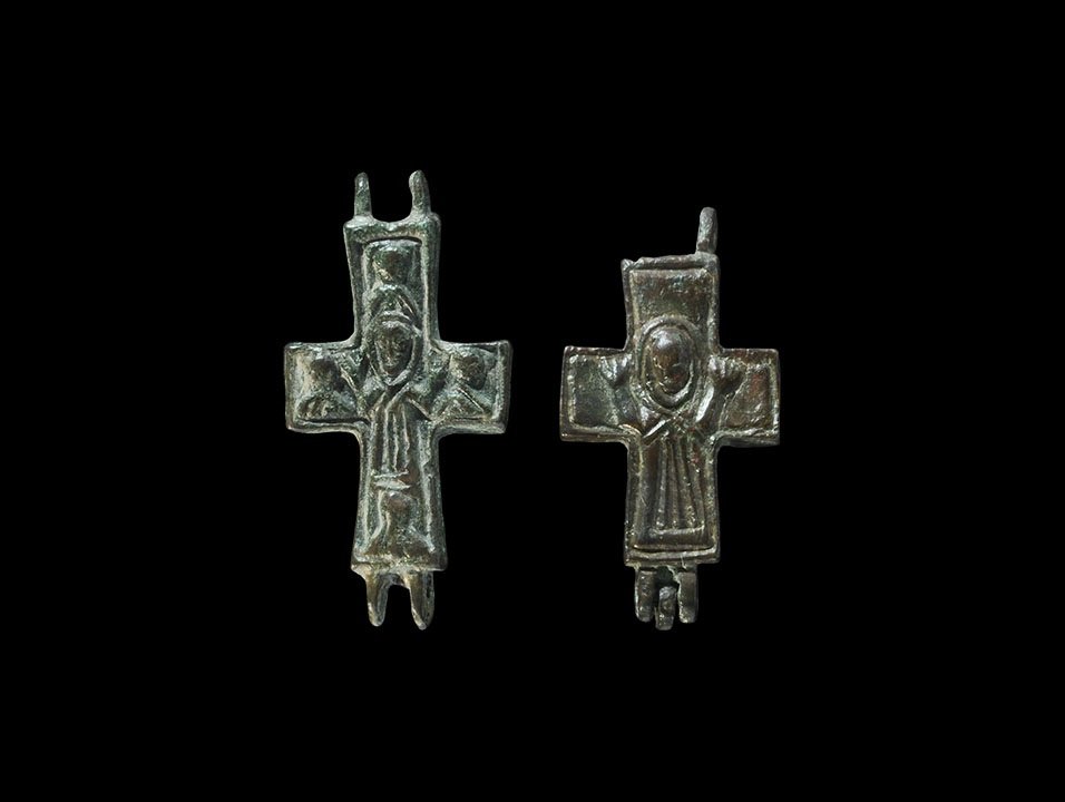 Christian Byzantine Bronze Reliquary Cross Group: 7th-10th century AD. A group of two cast reliquary cross panels comprising: one with nimbate robed figure of Christ risen, hands raised; one with Christ risen surrounded by portrait busts. 18 grams, 4