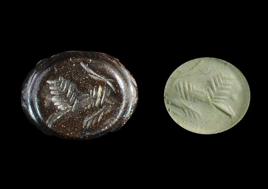 Near Eastern Sassanian Stone Stamp Seal with Lion: Sassanian Empire, 224-651 AD. A plano-convex stamp seal with intaglio lion motif, roundels to the upper face; supplied with impression. 6.43 grams total, 16 mm (1/2"). From an important Mayfair, Londo