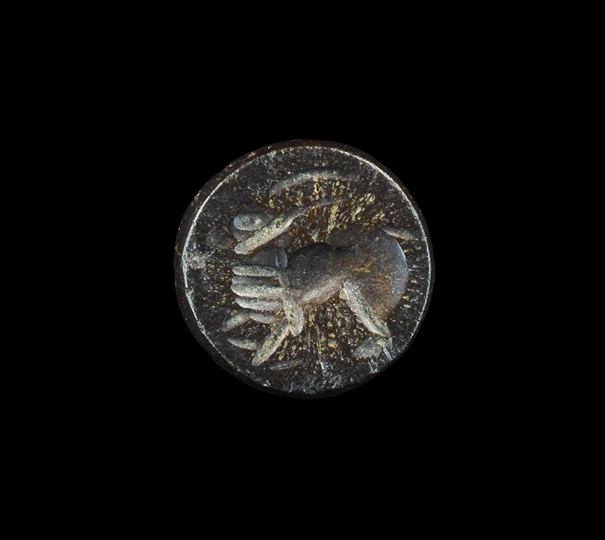 Near Eastern Sassanian Stone Stamp Seal with Ibex: Sassanian Empire, 224-651 AD. A plano-convex stamp seal with intaglio running ibex motif; supplied with impression. 3.99 grams, 13 mm (1/2"). From an important Mayfair, London, collection; acquired in