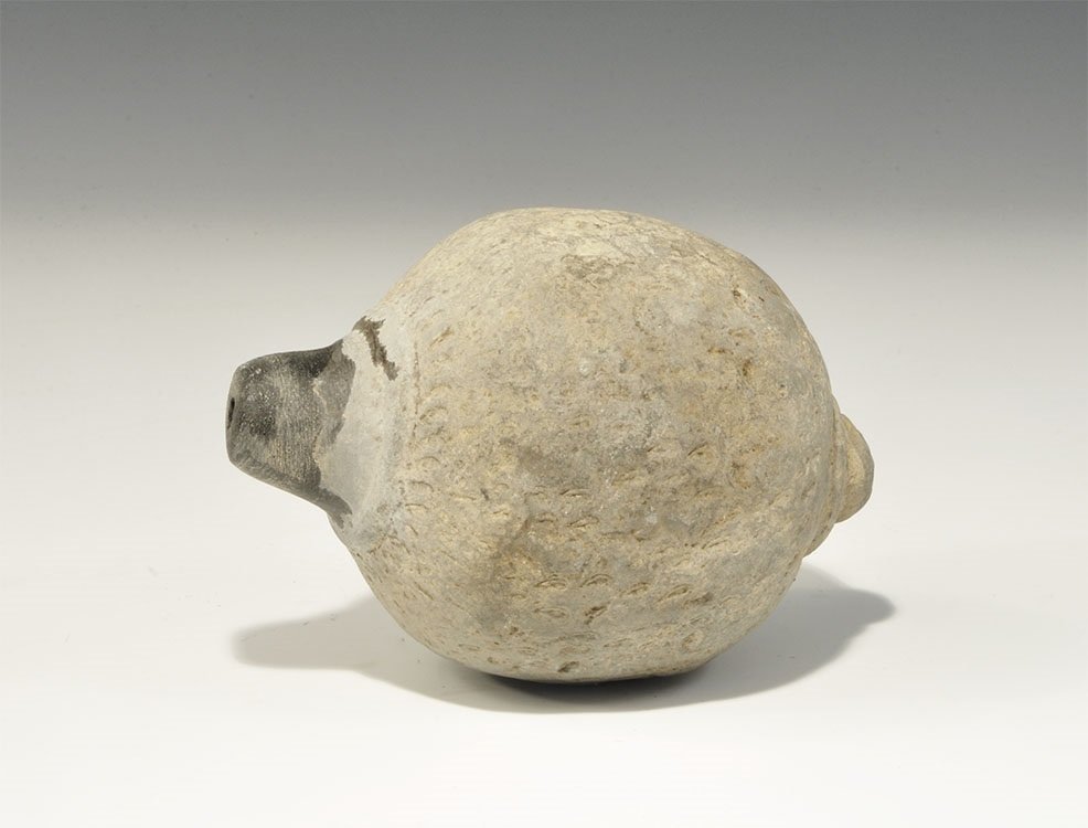 Byzantine Ceramic Greek Fire Grenade: 9th-11th century AD. A hollow ceramic vessel with broad sloped shoulder and conical base, the body decorated with circumferential bands of scales; wide circular rim enclosing the narrow mouth 754 gram