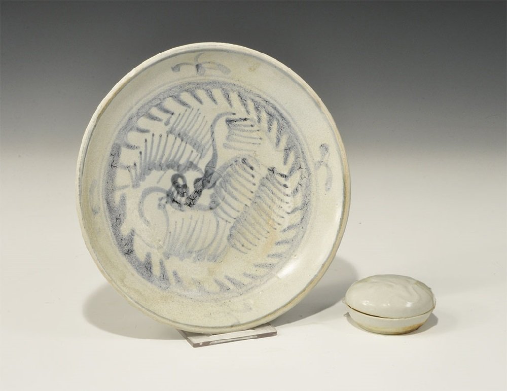 Chinese Glazed Ceramic Tek Sing Shipwreck Bowl Group: 19th century AD. A mixed group of pale blue glazed ceramics comprising: a dish with blue foliage and flowers to the upper face; a small lidded dish with low-relief foliage motif to the lid. 335 grams,
