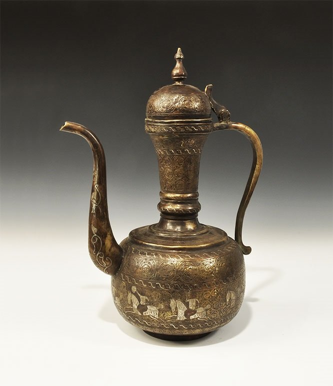 Islamic Bronze Silver-Inlaid Calligraphic Ewer: 20th century AD. A bronze ewer with globular body, balustered neck, curved handle and spout, domed lid with knop handle and hinge; silver-inlaid guilloche and foliate designs to the body and spout and