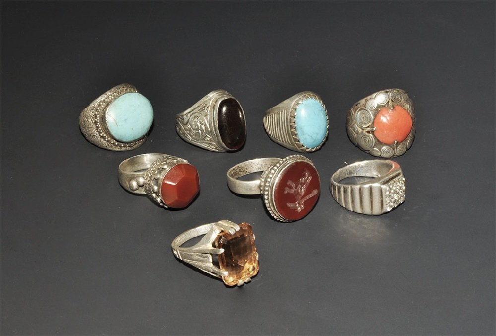 Jewellery Silver Coloured Metal and Stone Intaglio Ring: 20th century AD. A mixed group of eight finger rings with cabochon and cloison inserts of natural stones and glass. 93 grams total, 26-32mm (1 - 1 1/4"). Private collection, London, UK; acquired prior