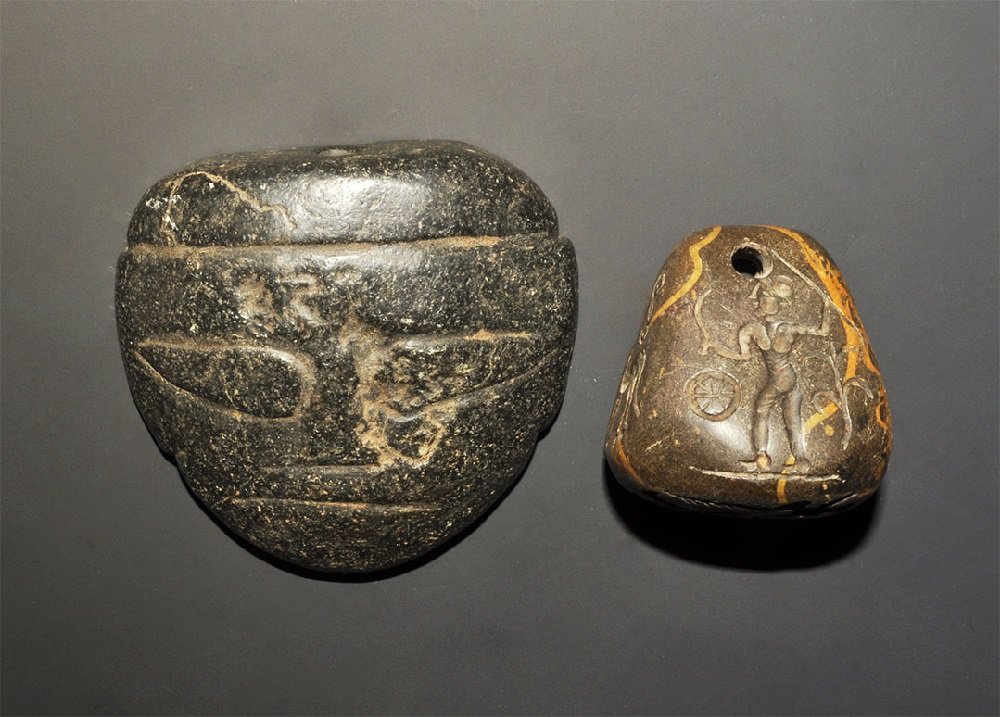 Near Eastern Carved Stone Seal Group: A mixed group of undated archaistic stone stamp seals comprising: one D-shaped with human mask detail to the upper face, drilled motif to the underside carved in diorite; one pyramidal with pierced ap