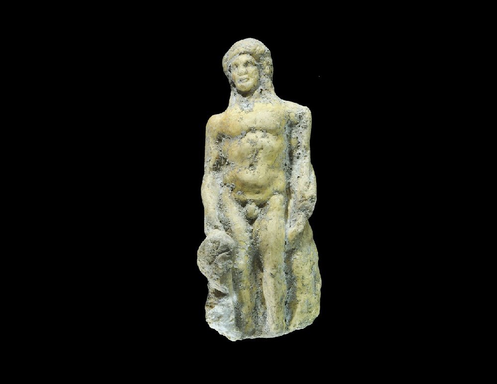Roman Marble Mercury Statuette: 1st-2nd century AD. A carved figure of Mercury modelled in the round, standing nude with caduceus couched on the left arm, bag of coins in the right hand. 197 grams, 13cm (5"). Acquired on the London 
