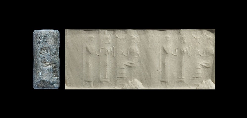 Near Eastern Ur Cylinder Seal with Seated Goddess: 2100-2000 BC. A carved limestone cylinder seal with frieze of standing robed figures and seated goddess, accompanied by an old scholarly note, typed and signed by W.G. Lambert, late Professor of Assyr