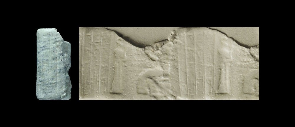 Near Eastern Old Babylonian Cylinder Seal with Seated: 2000-1800 BC. A carved limestone cylinder seal with seated god, attendant and cuneiform text, accompanied by an old scholarly note, typed and signed by W.G. Lambert, late Professor of Assyriology, Uni