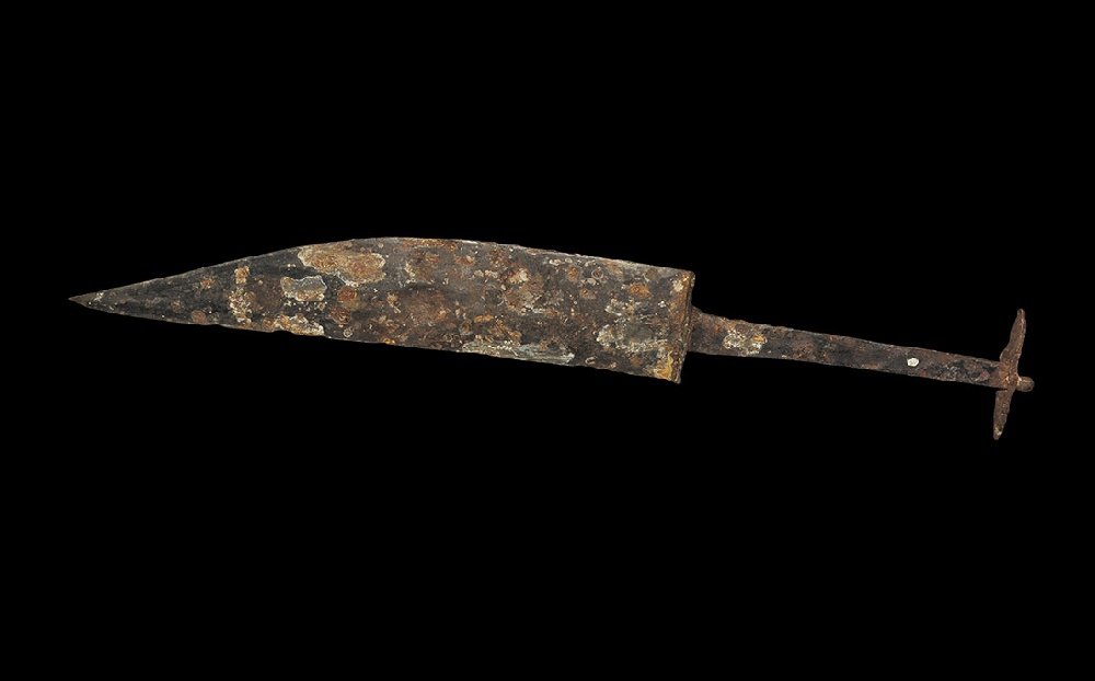 Iron Age Romano-Celtic Iron Dagger: 1st century BC-2nd century AD. A broad single-edged blade of 'broken-back' profile with rectangular bolster, flat-section tang, scaphoid upper guard. 218 grams, 36cm (14"). From an important London co