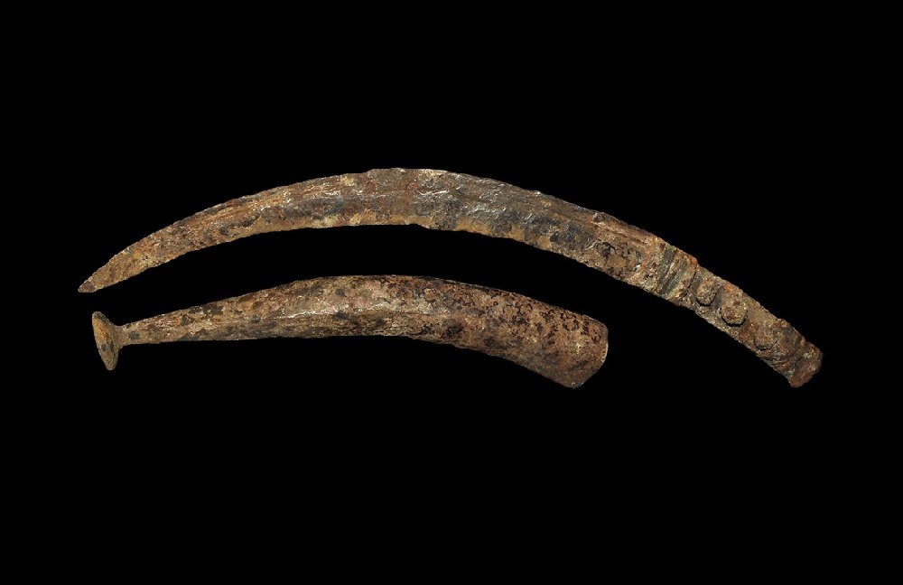 Iron Age Thracian Iron Dagger and Chape: 2nd century BC-2nd century AD. A curved single-edged knife with narrow shoulders and pierced tang; separate circular bolster and tubular scabbard chape with flared conical base. 417 grams total, 40cm