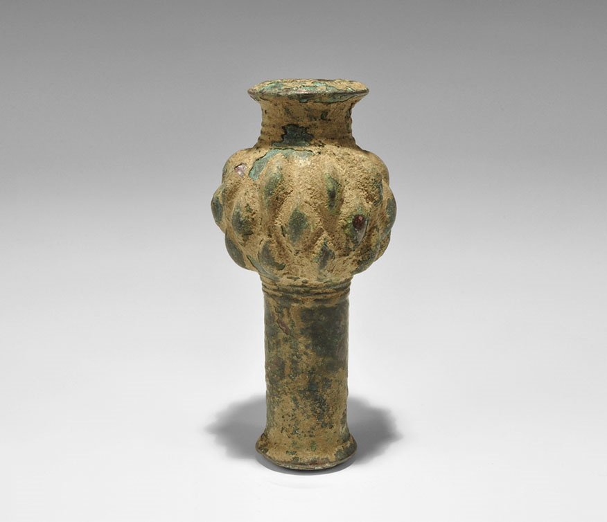 Near Eastern Luristan Bronze Ribbed Macehead: 1250-650 BC. A tubular Bronze Age macehead with flanges to the sockets, ribbed collars, bulb with flanged surface. 368 grams, 12cm (4 3/4"). From an old English collection; acquired in the 1980s. Time