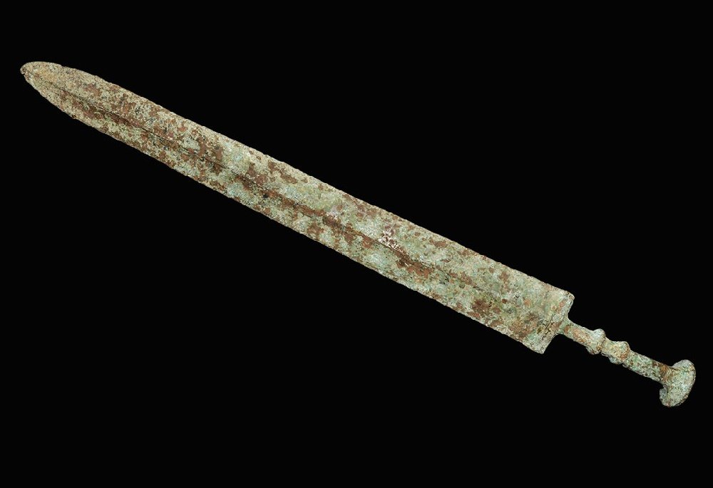 Chinese Bronze Short Sword: An undated archaistic cast Han Dynasty style sword with gently tapering blade, lozenge-section guard, columnar grip with two collars and discoid pommel. 404 grams, 46.5cm (18 1/4"). Property of a Lond