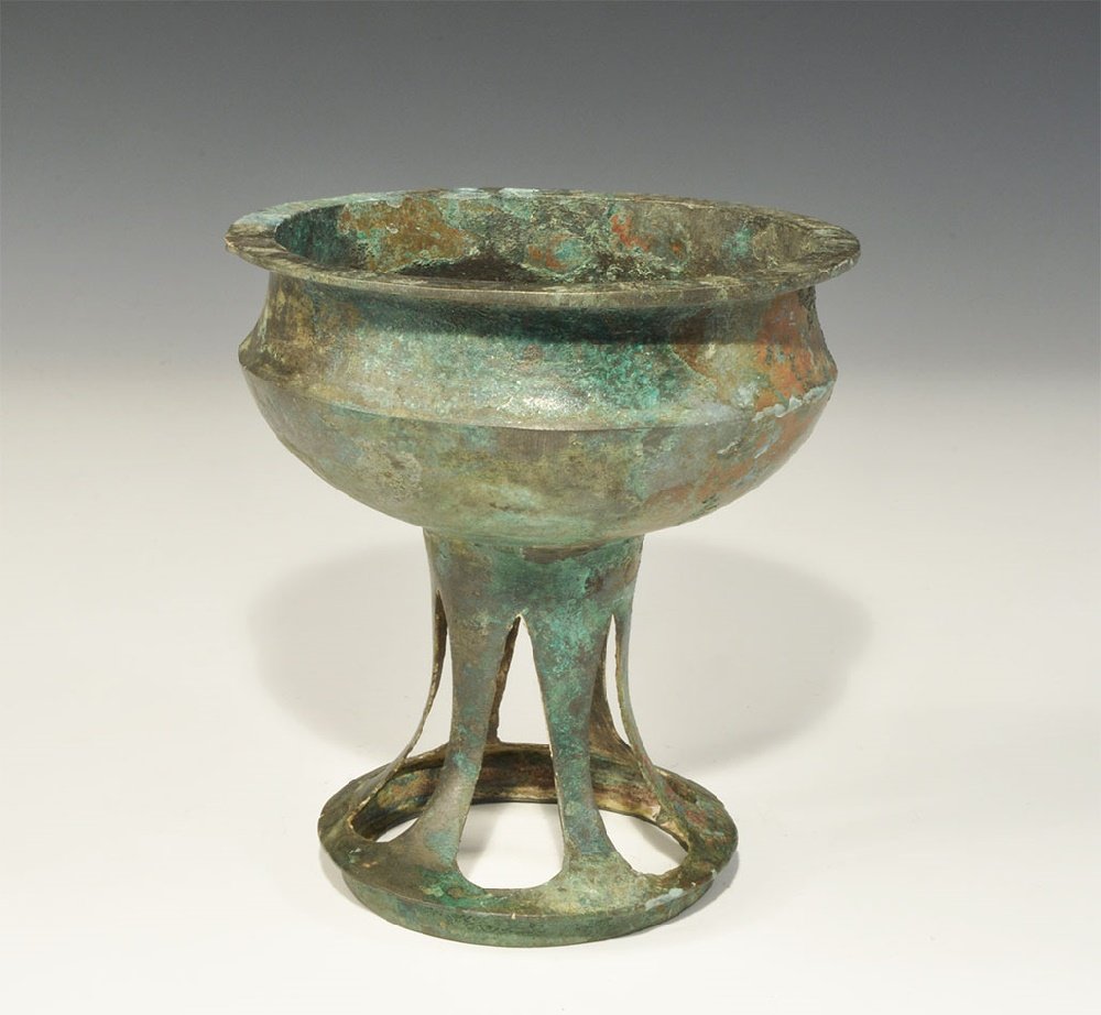 Chinese Style Bronze Incense Burner: An undated archaistic cast incense burner with carinated shoulder, tubular openwork stem and flared base. 630 grams,15.5cm (6"). From an old London collection, formed in the 1980s. TimeLine Auctions L