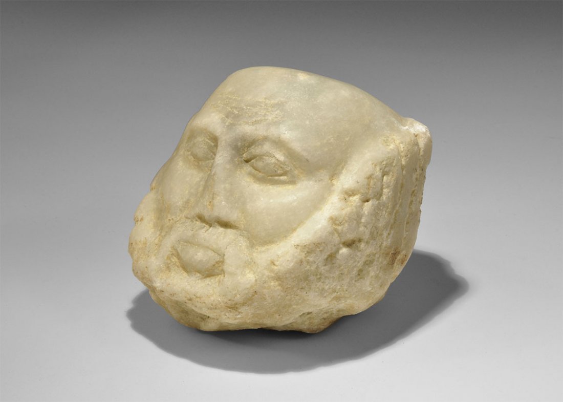 Near Eastern South Arabian Yemeni Stone Head: . An undated archaistic carved marble balding male head in 1st century AD style, with beard and moustache. 2.8 kg, 12cm (4 3/4"). Property of a West London gentleman; acquired between 1980-2010. TimeL