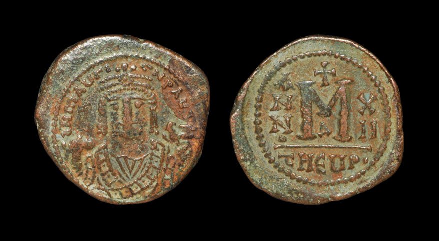 Ancient Byzantine Coins - Maurice Tiberius - Follis: . 582-602 AD, Antioch mint. Obv: DN MAV GI CN P AVG legend with crowned and mantled bust facing, trefoil on crown, holding mappa and eagle-tipped sceptre. Rev: large M, ANNO to left, year XII to right