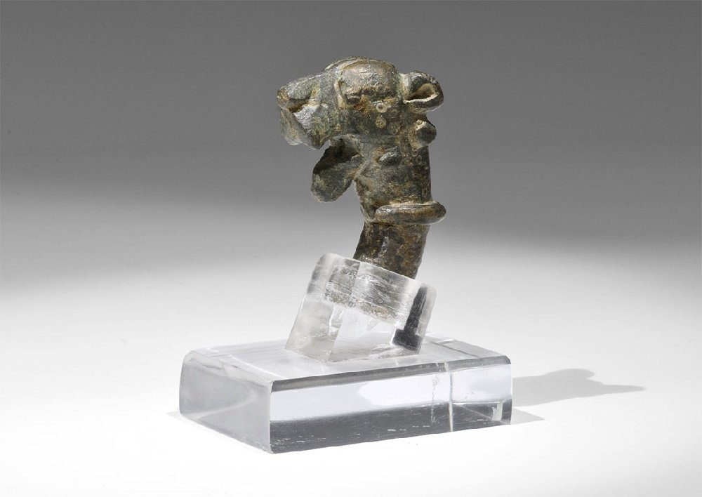 Islamic Bronze Panther-Head Staff Finial: 1st-2nd century AD. A cast head with gaping mouth, collar to the neck; socket to the underside; mounted on a custom-made stand. 187 grams, 79mm including stand (3 1/4"). Property of a West London gent
